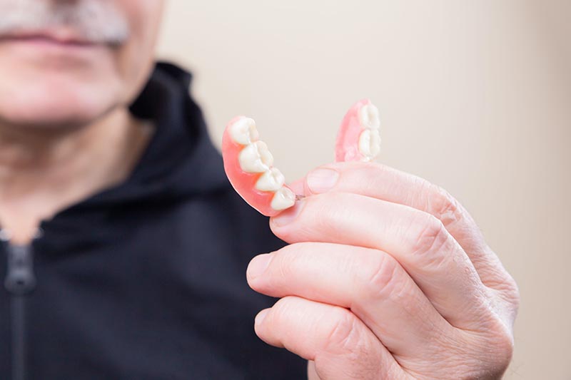 Even Fake Teeth Need to be Brushed: 5 Ways to Care for Your Dentures