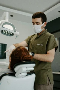 A dentist operating on a patient.